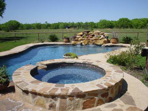 pool with attached spa